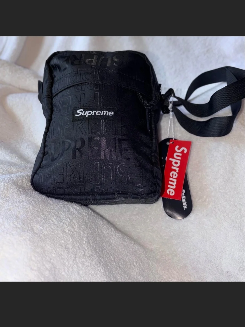 Supreme Black Embossed Logo Shoulder Bag with Red Tag